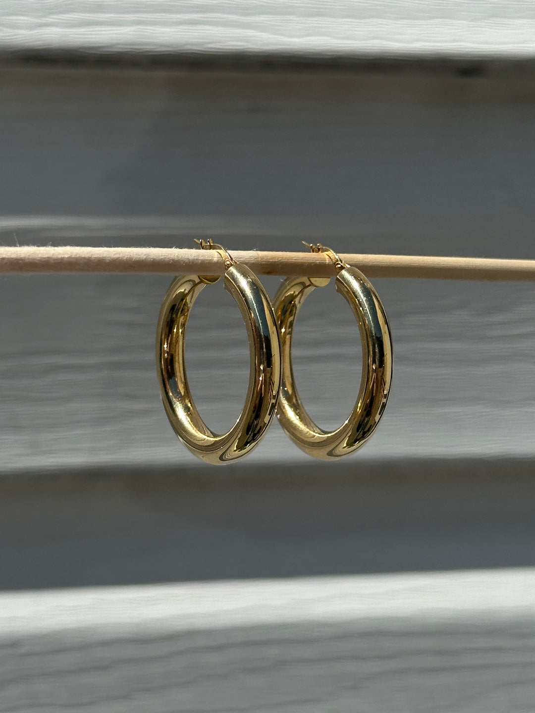 Butter up your jewelry collection with our must-have Chunky Hoop Earrings. Crafted from fine 18k yellow gold, these hoops are as radiant as they come. Designed to be your favourite everyday piece, they're perfect for adding a dash of luxe to any look.