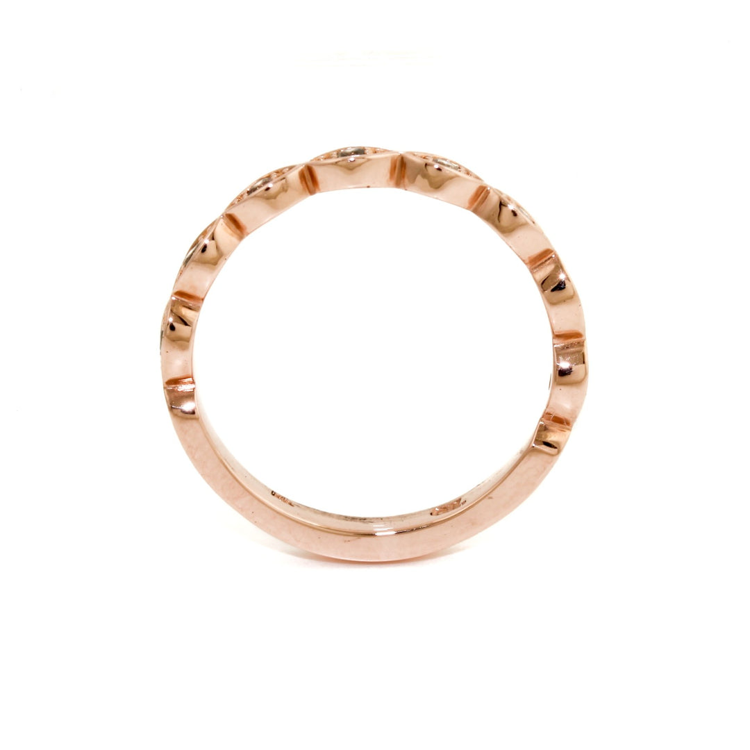 Gorgeous contemporary tiara style ring lined with diamonds that can be stacked with an engagement ring creating a wedding suite, or stacked up and added to your collection!