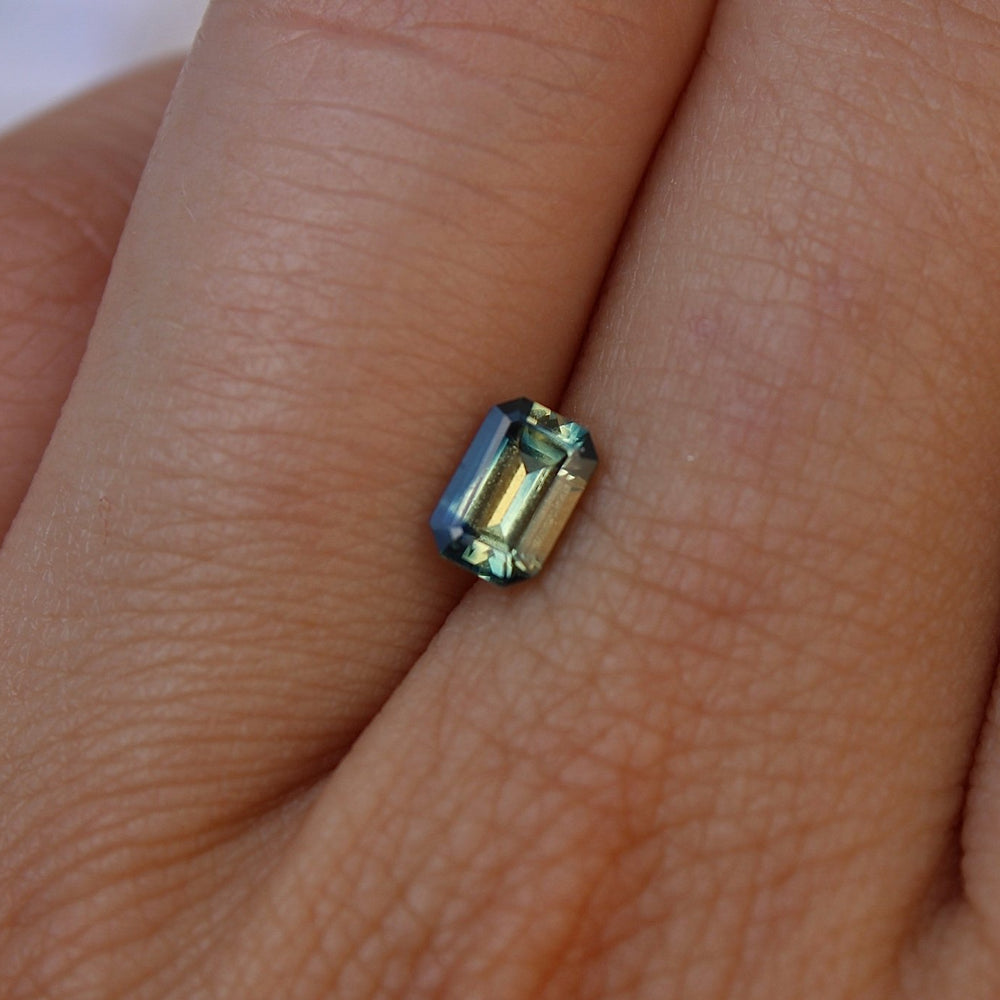 
                      
                        0.75ct Emerald Cut Bi Colour Sapphire - Kingdom Jewelry
                      
                    