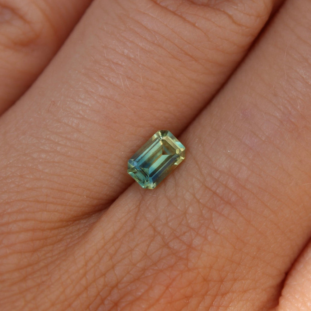 
                      
                        0.75ct Emerald Cut Parti Sapphire - Kingdom Jewelry
                      
                    