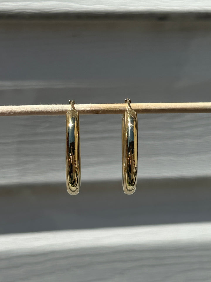 Butter up your jewelry collection with our must-have Chunky Hoop Earrings. Crafted from fine 18k yellow gold, these hoops are as radiant as they come. Designed to be your favourite everyday piece, they're perfect for adding a dash of luxe to any look.