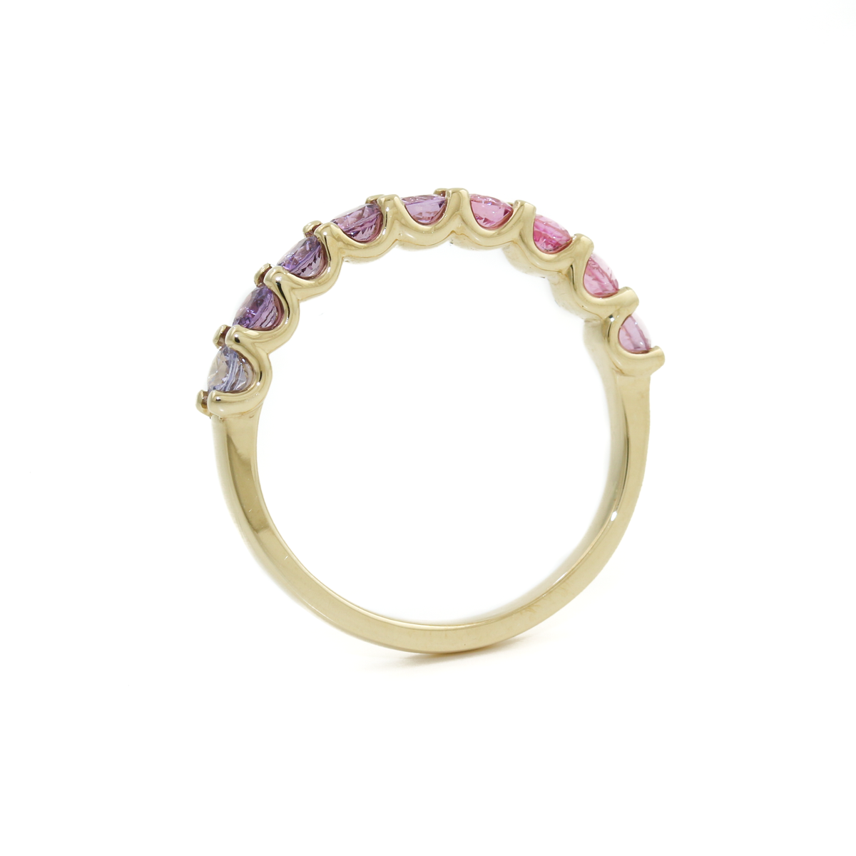 Indulge in the beauty of this Pink Sapphire band, skillfully crafted in 14K Yellow Gold.   These pinky/ purple sapphires have been expertly cut into alluring round shape, enhancing their brilliance and color saturation. The 14K yellow gold band provides a radiant and complementary setting, accentuating the sapphires' natural beauty in a bead setting. 