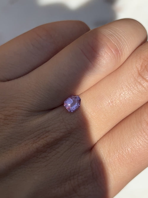 Discover the allure of this utterly exquisite 0.88ct geometric sapphire, perfect for becoming the centrepiece of your dream jewelry. Its mesmerizing facets capture rich lavender and pink tones, making it an exceptional and unique gemstone.