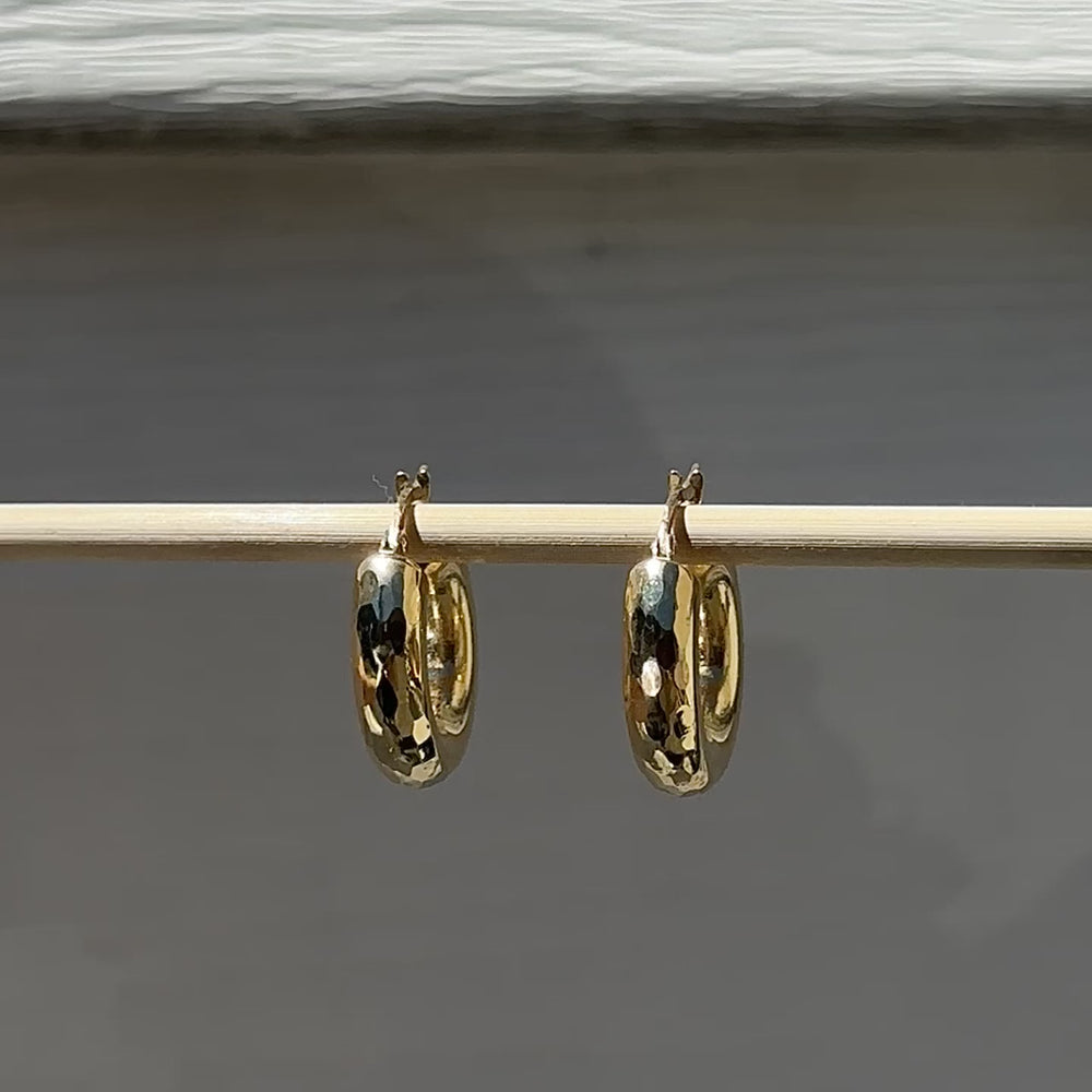 
                      
                        Load and play video in Gallery viewer, Butter up your jewelry collection with our must-have Faceted Hoop Earrings. Crafted from fine 18k yellow gold, these hoops are as radiant as they come. Designed to be your favourite everyday piece, they&amp;#39;re perfect for adding a dash of luxe to any look.
                      
                    