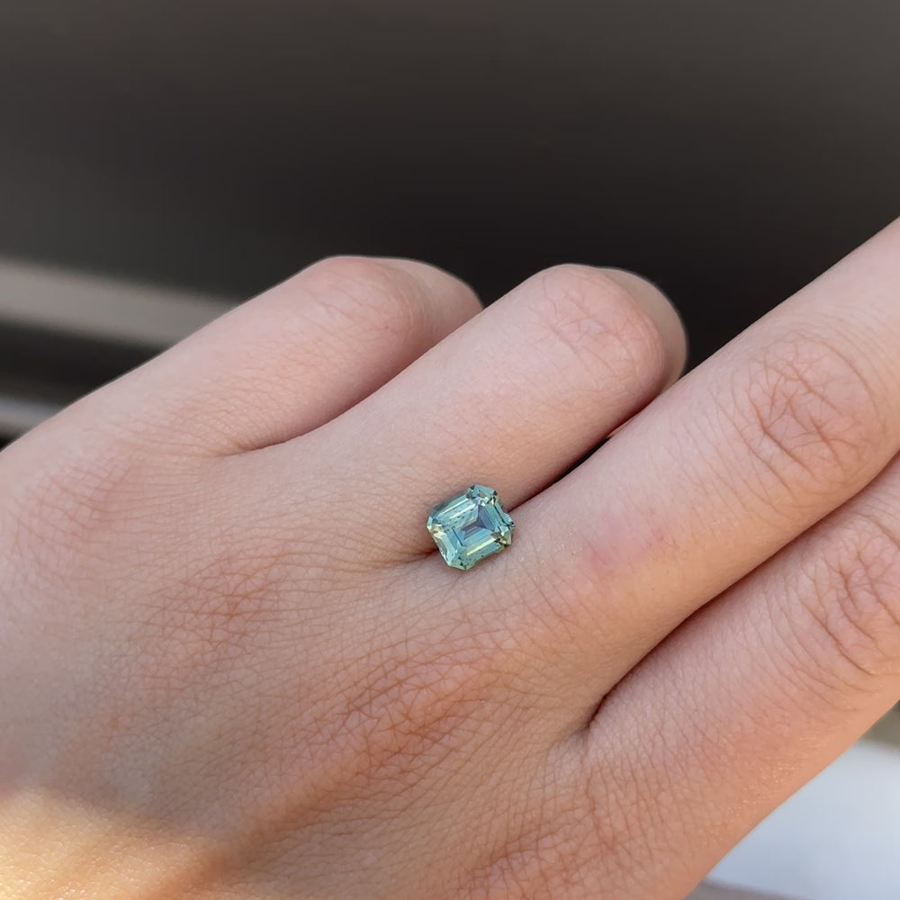 
                      
                        Load and play video in Gallery viewer, Create the ring of your dreams with this 2.10ct asscher cut teal sapphire. This utterly stunning gemstone holds an alluring tone of aqua teal and vibrant green within its facets, making it truly one-of-a-kind.
                      
                    