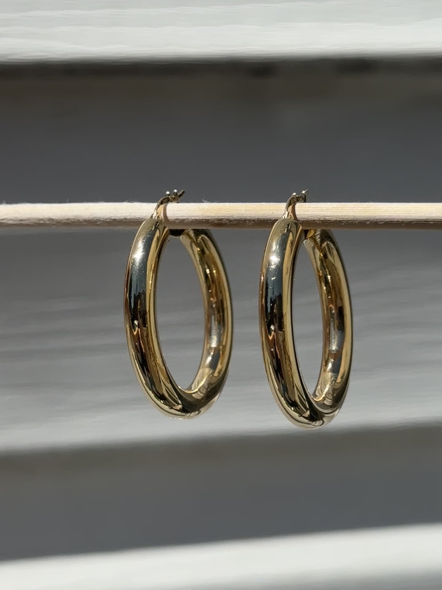 Butter up your jewelry collection with our must-have Chunky Hoop Earrings. Crafted from fine 18k yellow gold, these hoops are as radiant as they come. Designed to be your favourite everyday piece, they're perfect for adding a dash of luxe to any look.