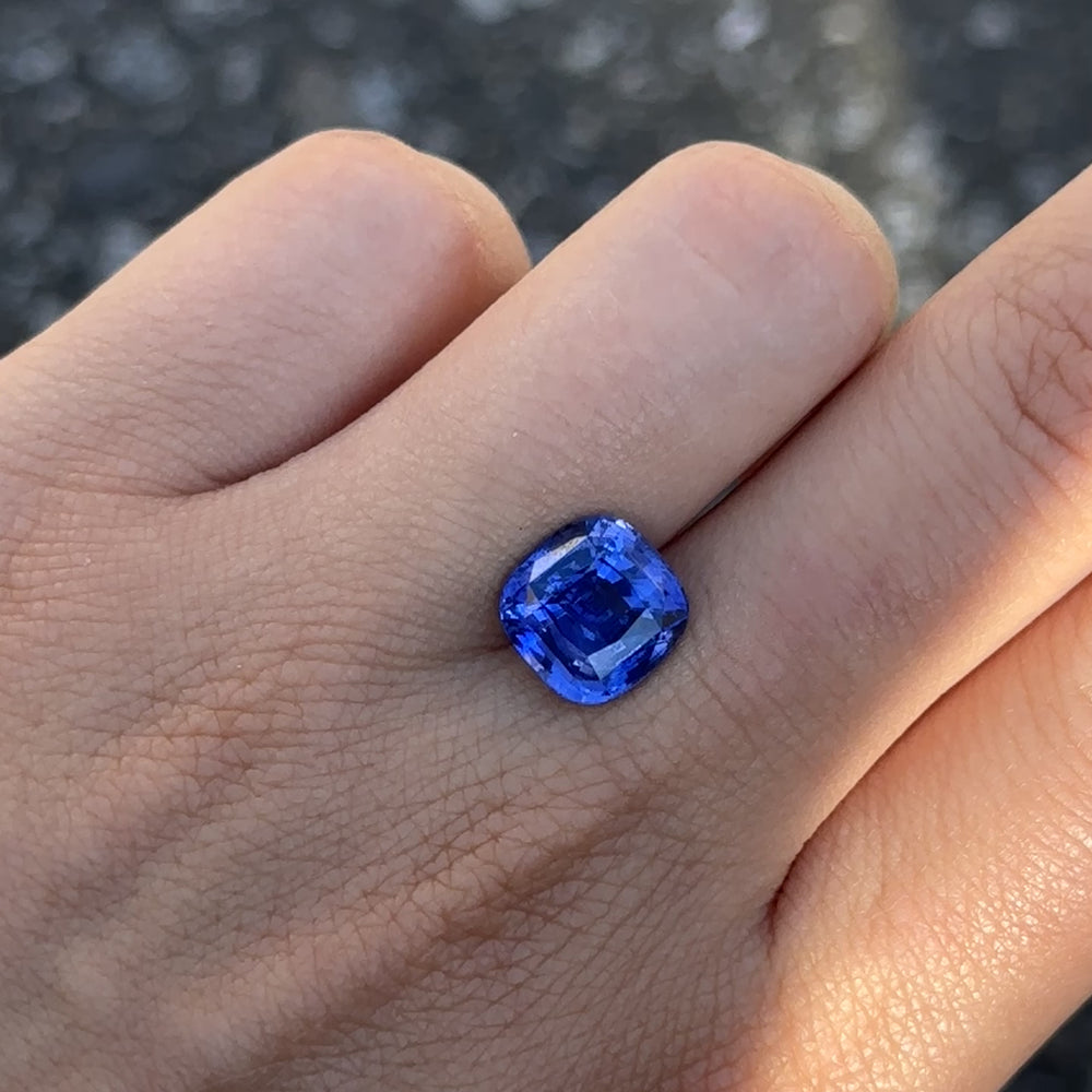 
                      
                        Load and play video in Gallery viewer, Create the ring of your dreams with this incredible 6.15ct cushion-cut royal blue sapphire. This utterly gorgeous gemstone holds an alluring, regal royal blue colour throughout; a truly one-of-a-kind gemstone.
                      
                    