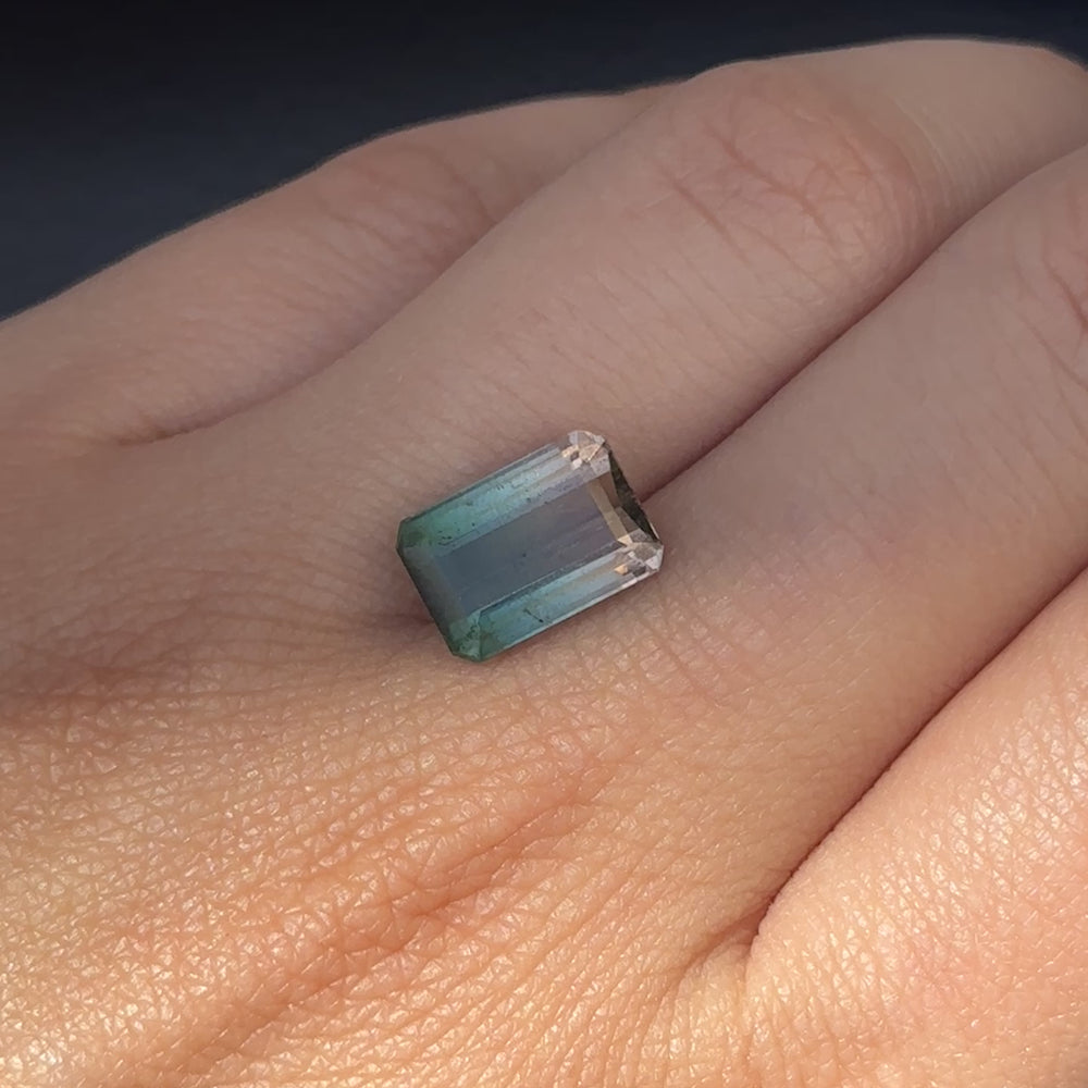 
                      
                        Load and play video in Gallery viewer, Create the jewelry piece of your dreams with this exquisite 4.38-carat emerald-cut bi-colour tourmaline. Magnetic deep green saturates into a gorgeously vivid light pink, making this gemstone truly one of a kind.  SKU: BCT11 (AUM)
                      
                    