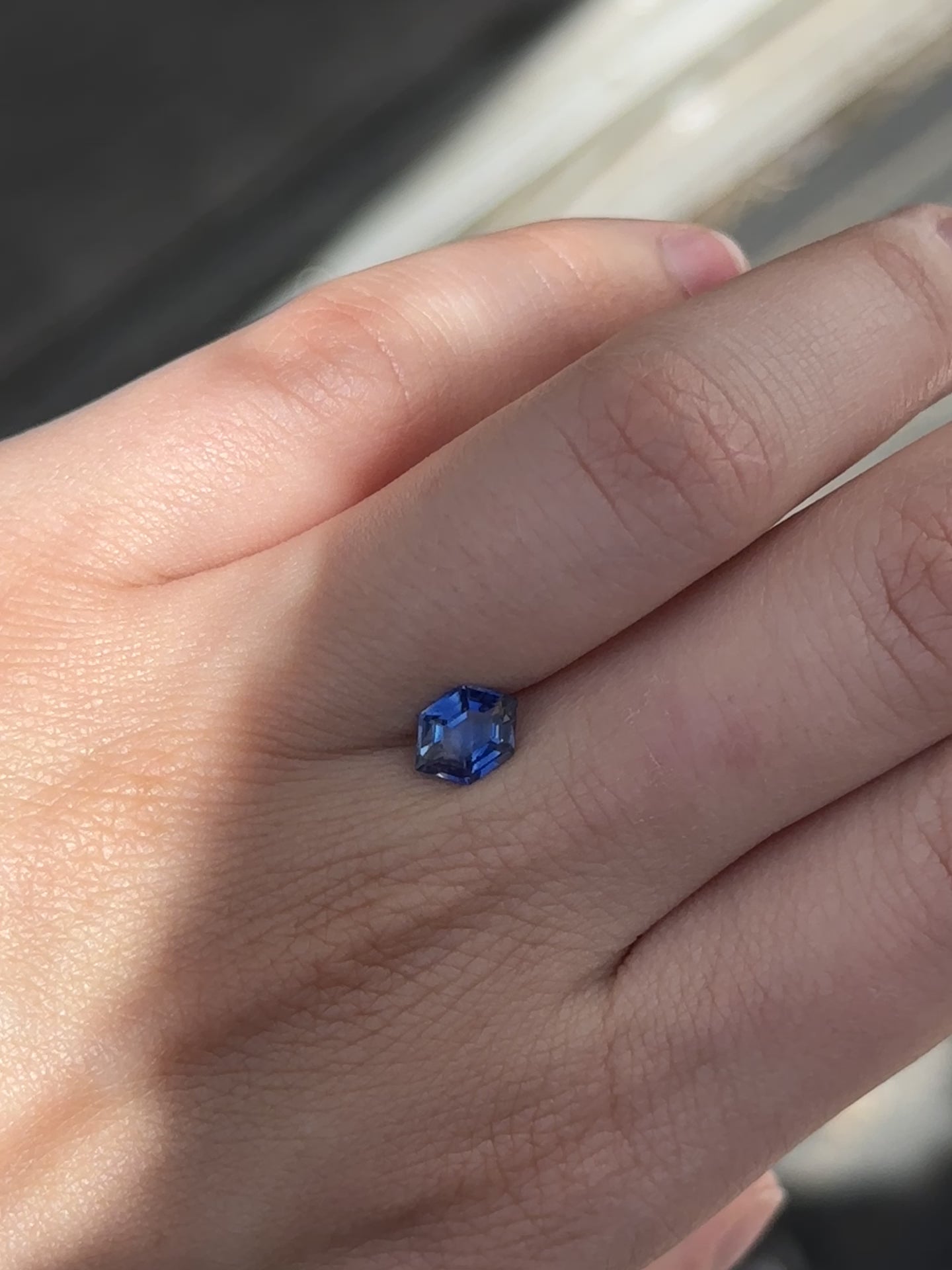 Create the ring of your dreams with this mesmerizing 1.45ct hexagon cut royal blue sapphire. This utterly stunning unheated gemstone catches tones of deep, fascinating blue with striations within its facets, making it a truly one-of-a-kind gemstone.