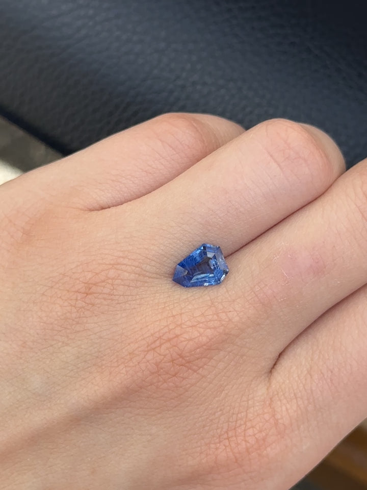 Create the ring of your dreams with this mesmerizing 1.90ct shield cut royal blue sapphire. This utterly stunning unheated gemstone catches tones of deep, fascinating blue with striations within its facets, making it a truly one-of-a-kind gemstone.