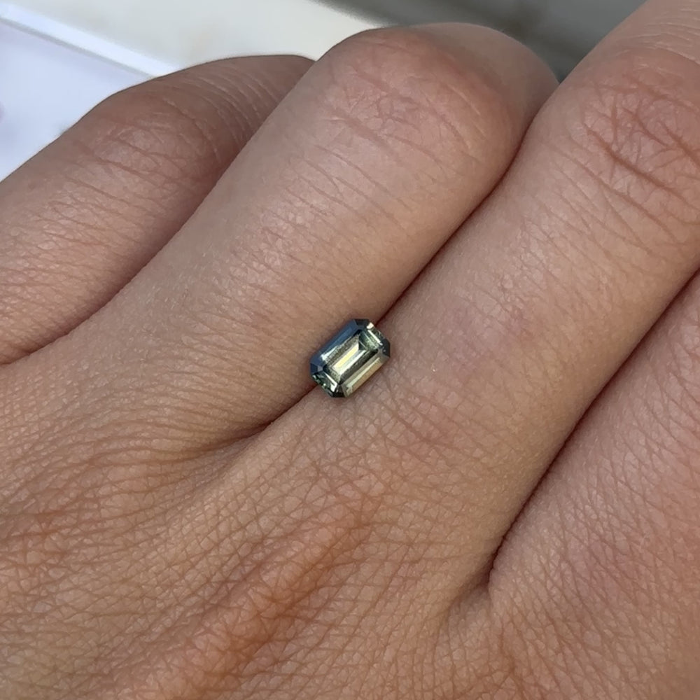 
                      
                        Load and play video in Gallery viewer, 0.75ct Emerald Cut Bi Colour Sapphire
                      
                    