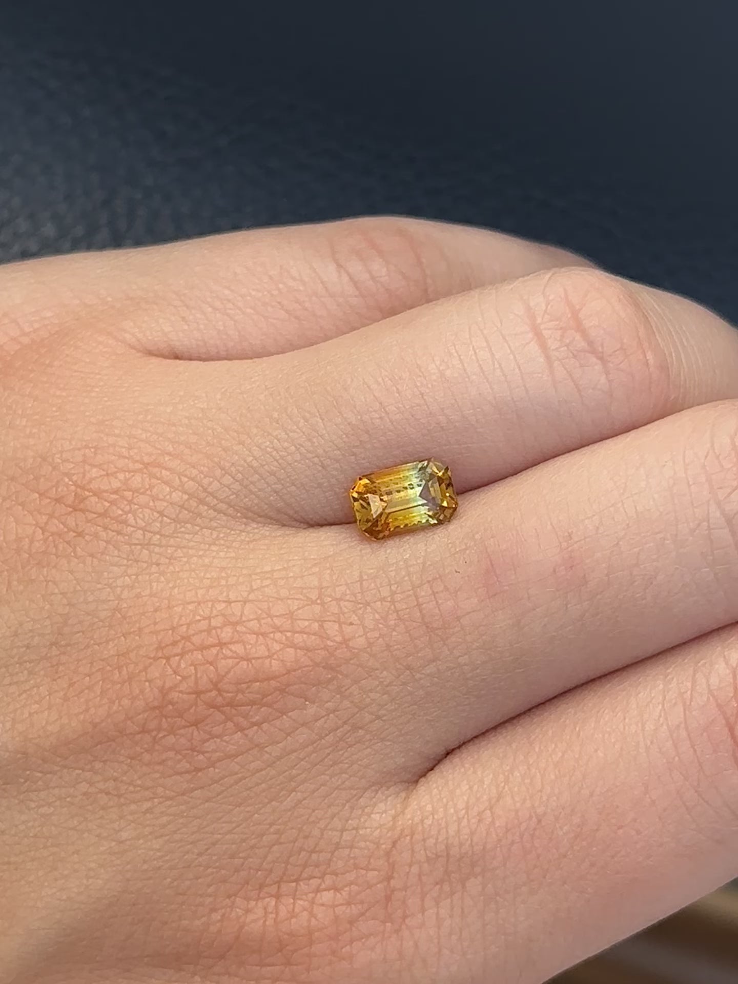 Create the ring of your dreams with this 2.06ct emerald-cut Madagascar parti sapphire. This utterly stunning gemstone is natural and unheated, catching rich sunflower yellow and brilliant fern green tones within its facets, making it truly one-of-a-kind.