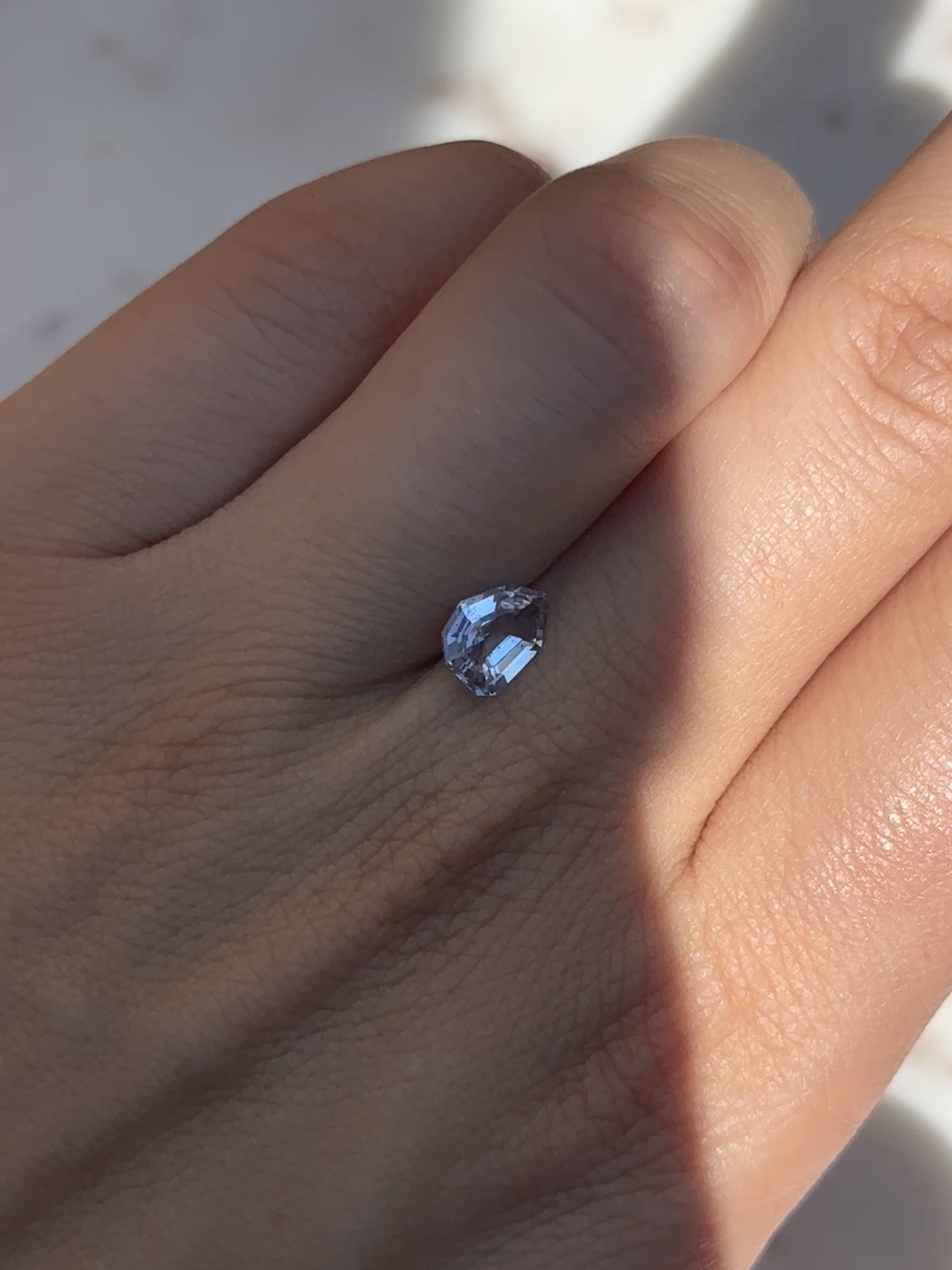 Discover the allure of this utterly exquisite 1.18ct geometric sapphire, perfect for becoming the centrepiece of your dream jewelry. Its mesmerizing facets capture icy blue tones, making it an exceptional and unique gemstone.  1.18ct geometric unheated sapphire. Sourced firsthand by us at Kingdom Jewelry!