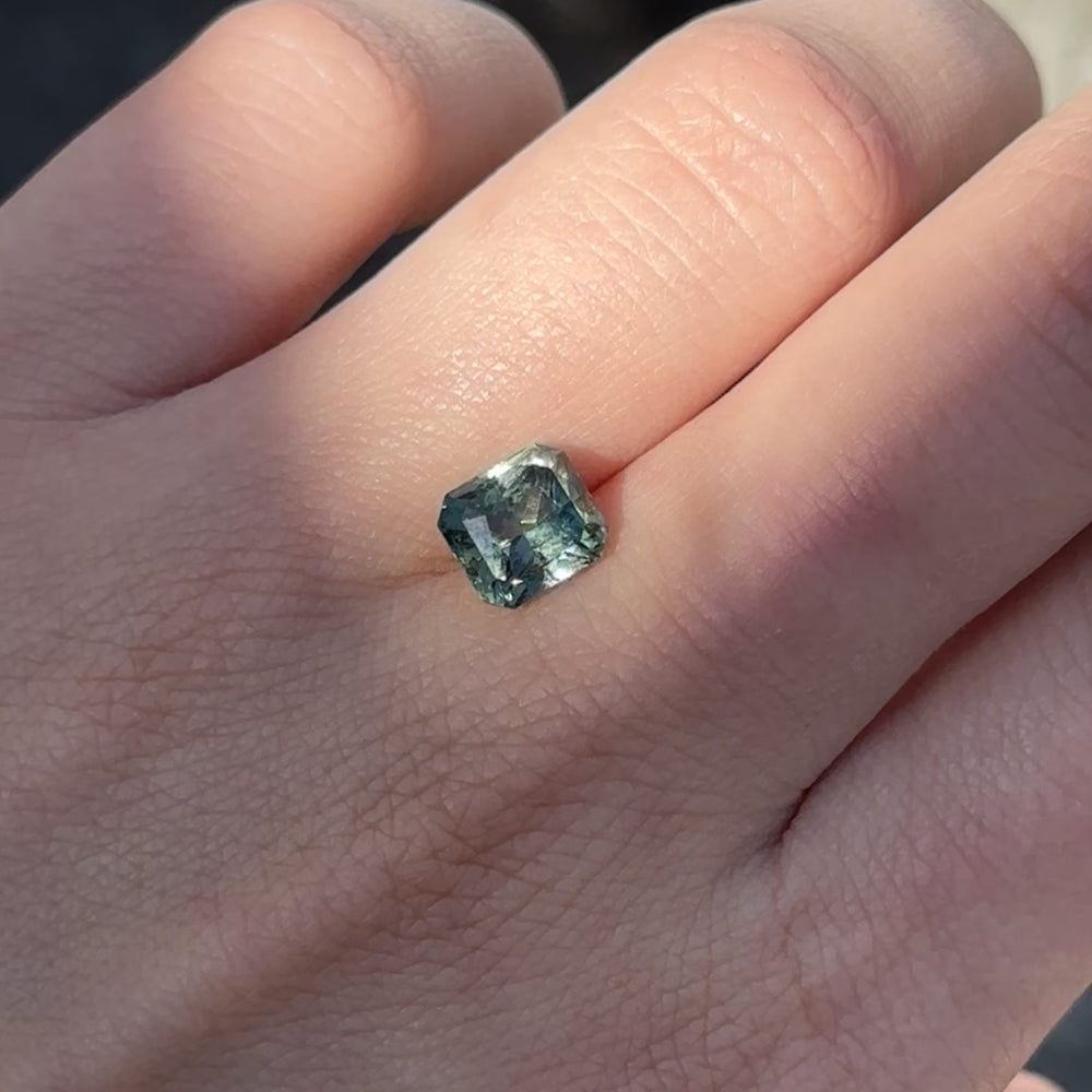 
                      
                        Load and play video in Gallery viewer, Create the ring of your dreams with this mesmerizing 3.55ct asscher cut aqua green sapphire. This utterly stunning unheated gemstone catches tones of aqua-teal and fern green within its facets, making it a truly one-of-a-kind gemstone.
                      
                    