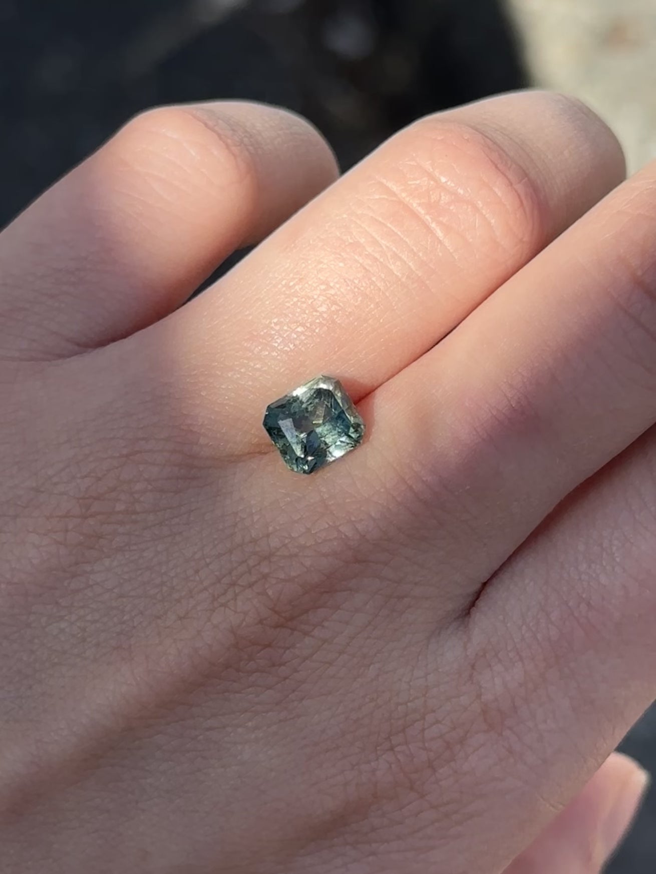 Create the ring of your dreams with this mesmerizing 3.55ct asscher cut aqua green sapphire. This utterly stunning unheated gemstone catches tones of aqua-teal and fern green within its facets, making it a truly one-of-a-kind gemstone.