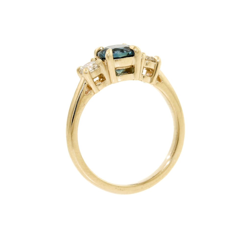 
                      
                        This exquisite ring features a mesmerizing dark blue Montana sapphire, carefully cut and polished to bring out the best of its natural radiance and captivating colour. The sapphire is perfectly complemented by the sparkling diamonds set in the 14k gold band, creating an unforgettable display of brilliance and elegance.
                      
                    