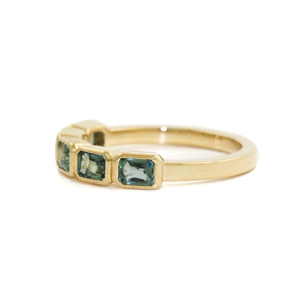 
                      
                        14K Gold Emerald-Cut Teal Sapphire Bezel-Set Band - Kingdom Jewelry
                      
                    