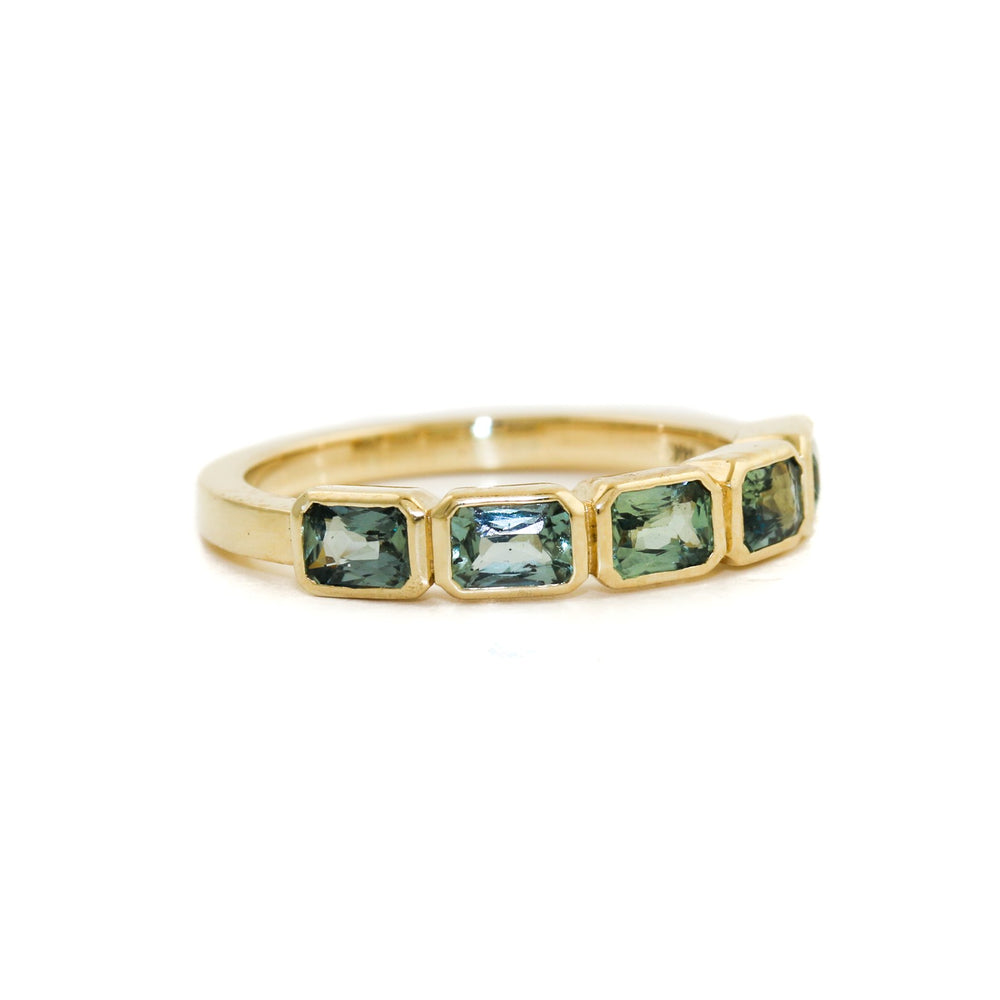 
                      
                        14K Gold Emerald-Cut Teal Sapphire Bezel-Set Band - Kingdom Jewelry
                      
                    