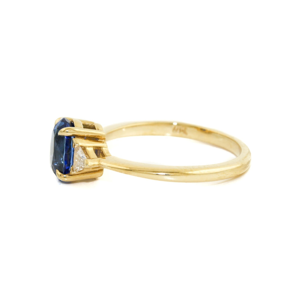 
                      
                        Introducing our breathtaking royal blue Montana sapphire ring with triangle cut diamonds set in 18k gold, a true masterpiece of beauty, luxury and elegance.
                      
                    