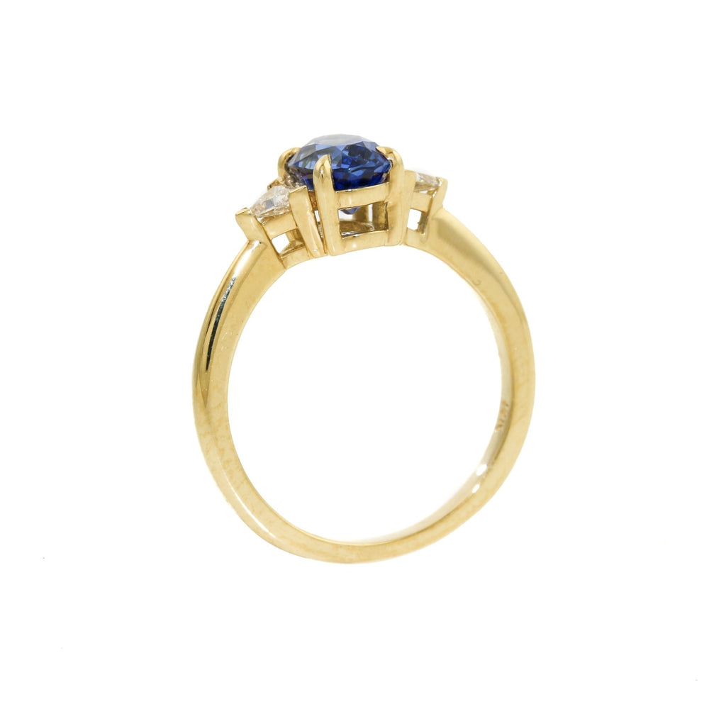 
                      
                        Introducing our breathtaking royal blue Montana sapphire ring with triangle cut diamonds set in 18k gold, a true masterpiece of beauty, luxury and elegance.
                      
                    