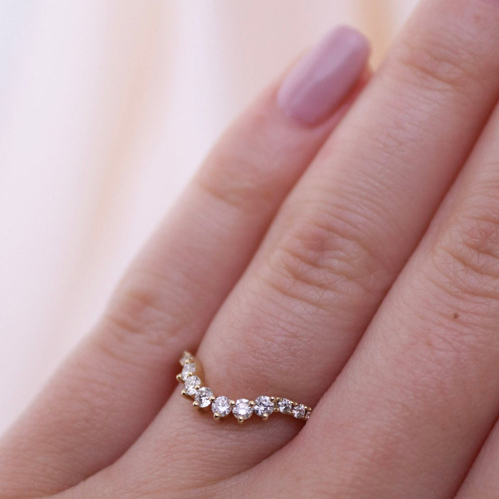 
                      
                        Gorgeous contemporary tiara style ring lined with diamonds that can be stacked with an engagement ring, creating a wedding suite, or stacked up and added to your collection!
                      
                    