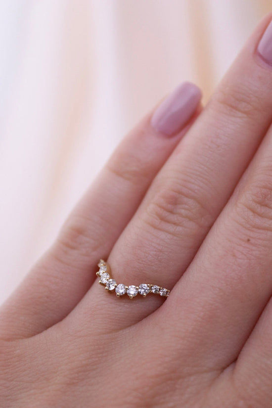 Gorgeous contemporary tiara style ring lined with diamonds that can be stacked with an engagement ring, creating a wedding suite, or stacked up and added to your collection!